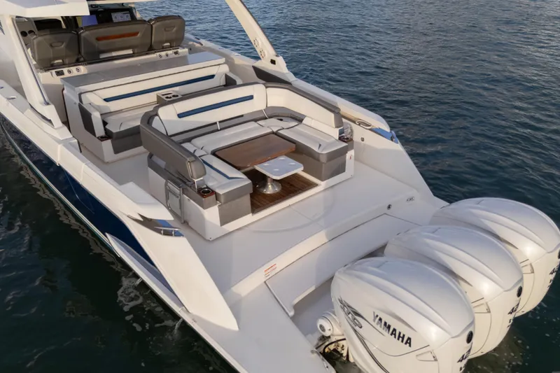 Slide: The Image of 2020 Tiara Yachts 43 LS with Yamaha engines, featuring luxurious seating and sleek design. - 12