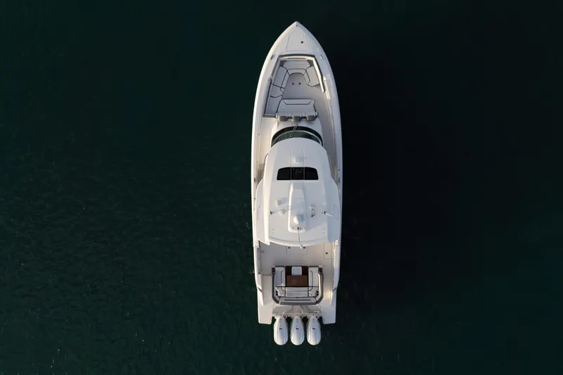 Slide: The Image of Aerial view of 2020 Tiara Yachts 43 LS on dark water. - 16