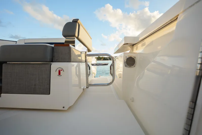 Slide: The Image of 2020 Tiara Yachts 43 LS deck view with seating and ocean backdrop. - 21