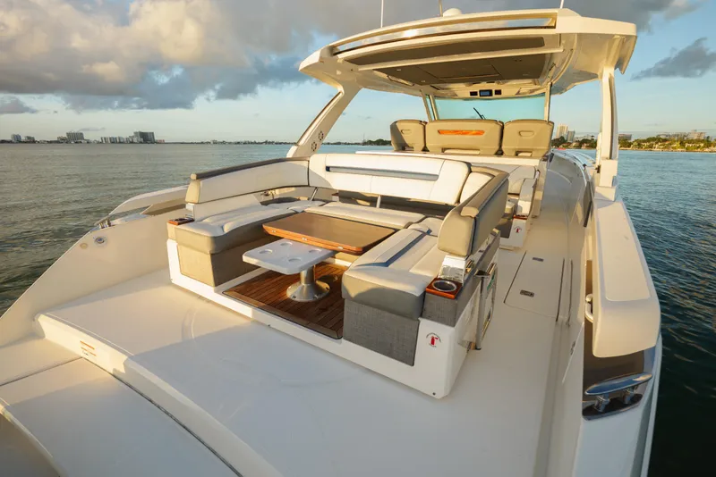 Slide: The Image of Luxurious 2020 Tiara Yachts 43 LS with elegant seating on calm waters. - 22