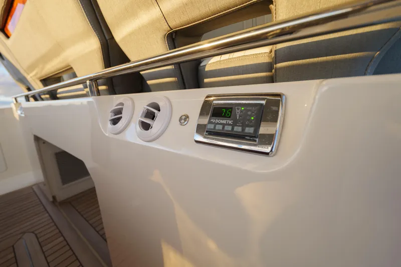 Slide: The Image of 2020 Tiara Yachts 43 LS interior with Dometic control panel and air vents. - 32