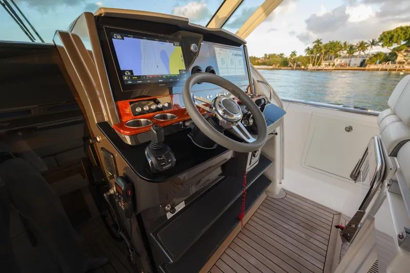 Slide: The Image of 2020 Tiara Yachts 43 LS helm with advanced navigation system and luxurious interior. - 35