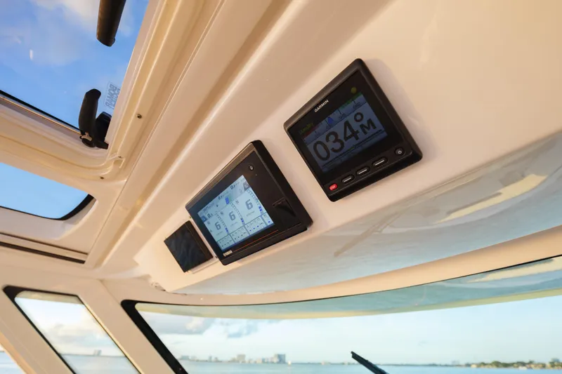 Slide: The Image of Dashboard of 2020 Tiara Yachts 43 LS with Garmin navigation displays. - 36