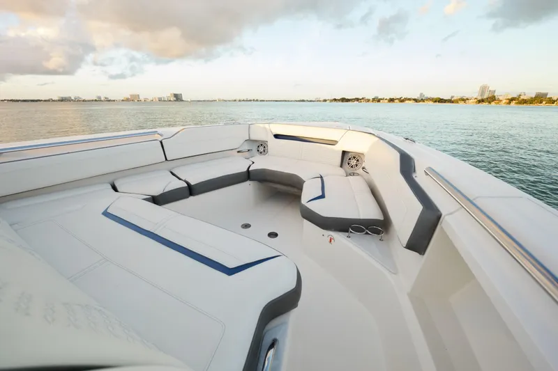 Slide: The Image of Luxurious seating area on a 2020 Tiara Yachts 43 LS, overlooking serene waters. - 38