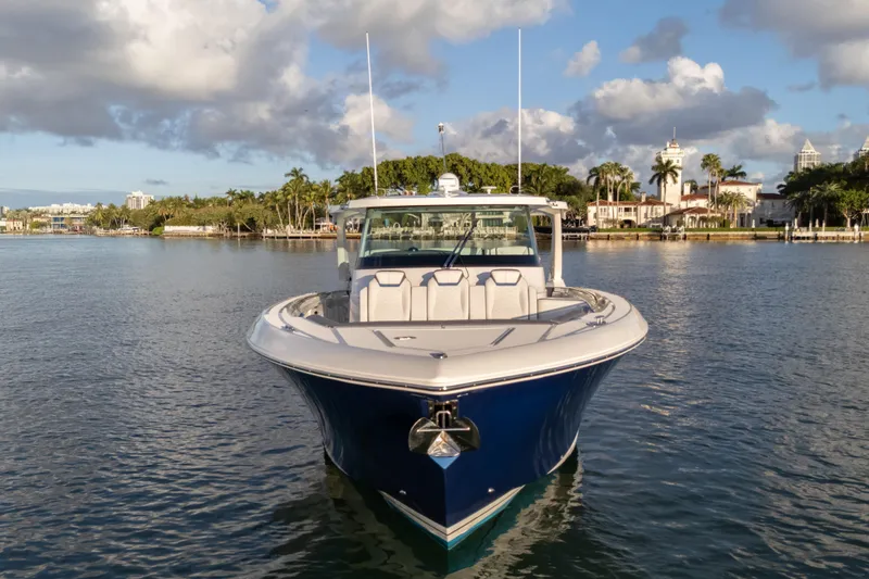 Slide: The Image of 2020 Tiara Yachts 43 LS on calm water, showcasing sleek design and luxury features. - 4