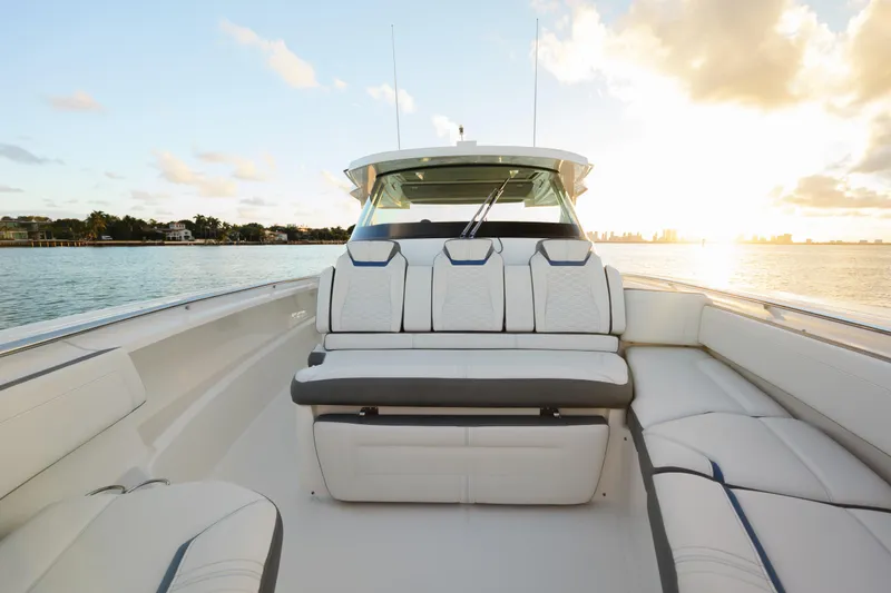 Slide: The Image of 2020 Tiara Yachts 43 LS boat interior with luxurious seating at sunset. - 40