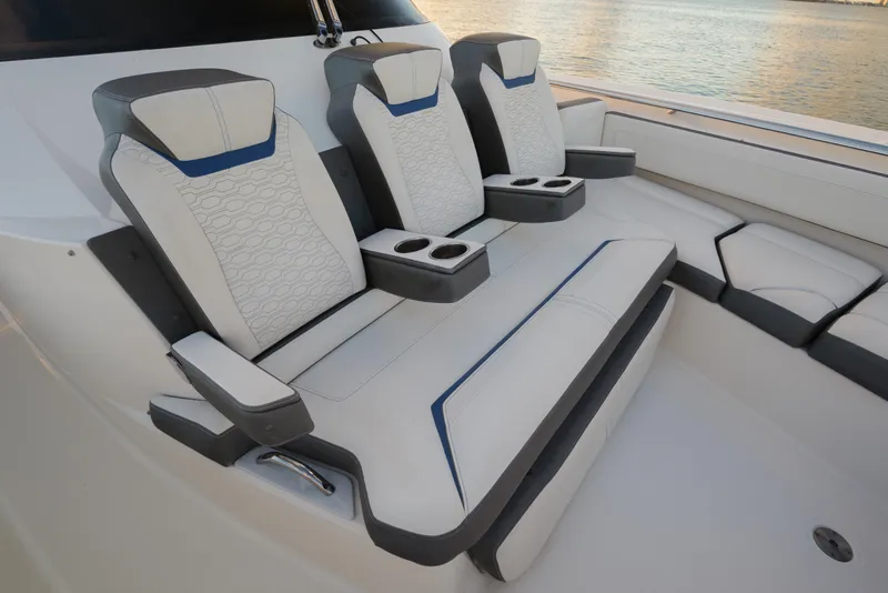 Slide: The Image of Luxurious seating on 2020 Tiara Yachts 43 LS, featuring elegant design and cup holders. - 41