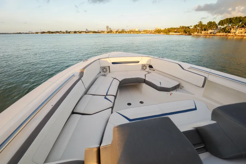 Slide: The Image of 2020 Tiara Yachts 43 LS boat interior with spacious seating, overlooking calm waters. - 43