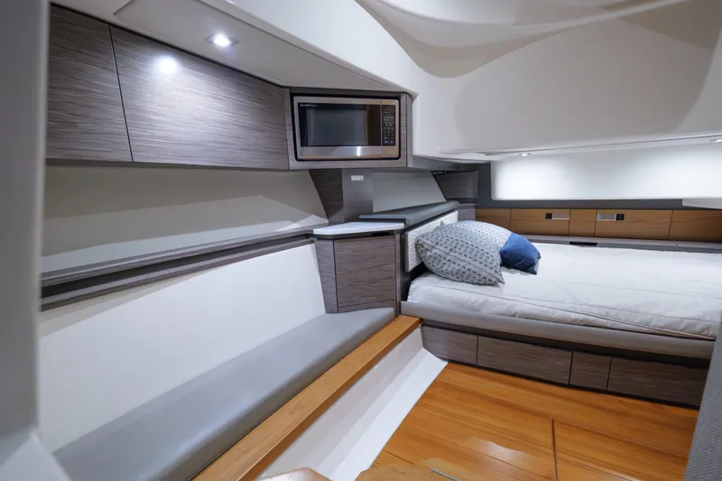 Slide: The Image of Luxurious interior of 2020 Tiara Yachts 43 LS with modern amenities and cozy bedding. - 47