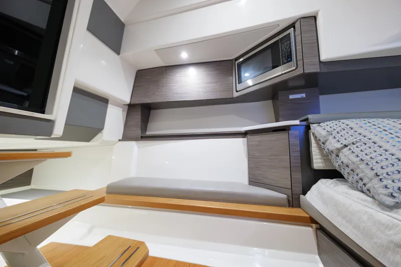 Slide: The Image of Interior of 2020 Tiara Yachts 43 LS, featuring modern design with microwave and seating area. - 48