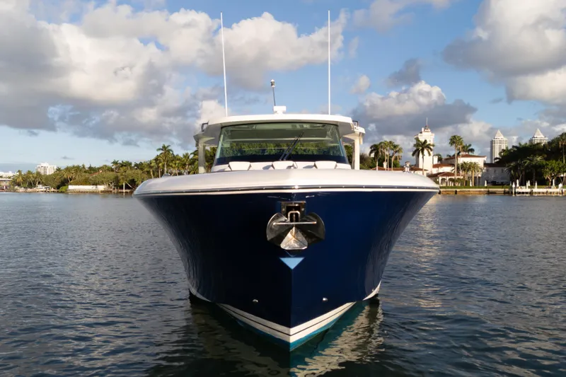 Slide: The Image of 2020 Tiara Yachts 43 LS on water, front view, under blue sky. - 5