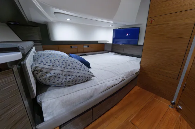 Slide: The Image of Luxurious cabin interior of 2020 Tiara Yachts 43 LS with cozy bedding and modern design. - 50