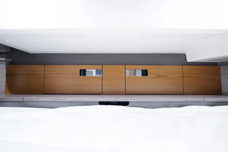 Slide: The Image of Interior view of 2020 Tiara Yachts 43 LS, featuring sleek wooden cabinetry. - 51