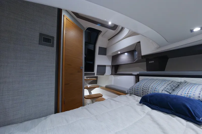 Slide: The Image of Luxurious interior of 2020 Tiara Yachts 43 LS, featuring modern design and comfortable bedding. - 53