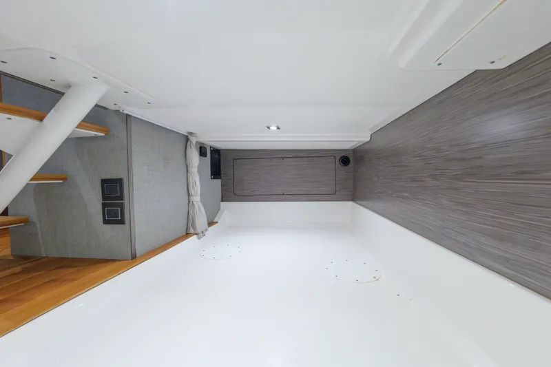 Slide: The Image of Interior of 2020 Tiara Yachts 43 LS, featuring modern design and wooden accents. - 55