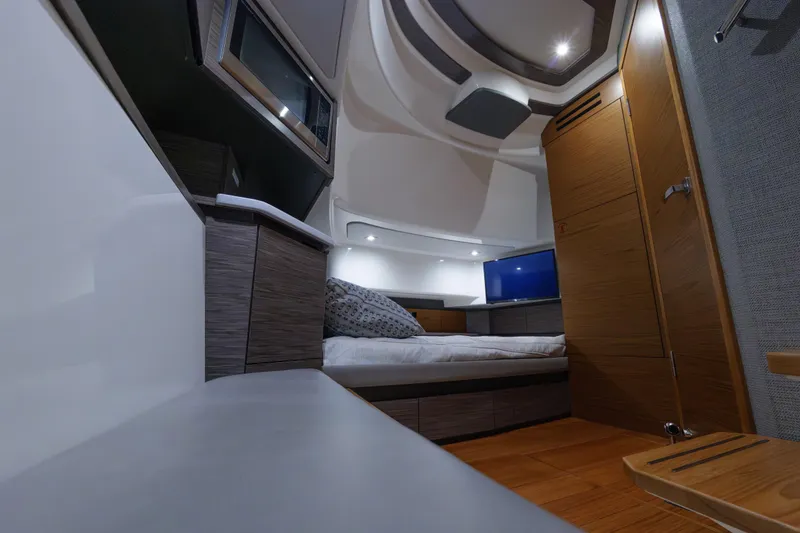 Slide: The Image of Luxurious interior of 2020 Tiara Yachts 43 LS, featuring modern design and cozy sleeping area. - 56