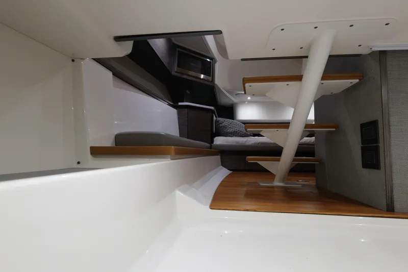 Slide: The Image of Interior of 2020 Tiara Yachts 43 LS, featuring modern design and wooden steps. - 58
