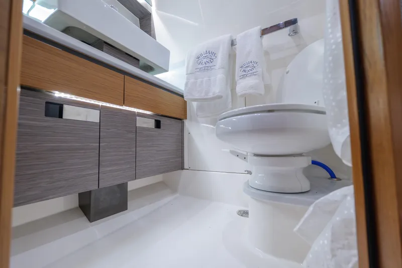 Slide: The Image of Luxurious bathroom in 2020 Tiara Yachts 43 LS, featuring modern fixtures and elegant cabinetry. - 59