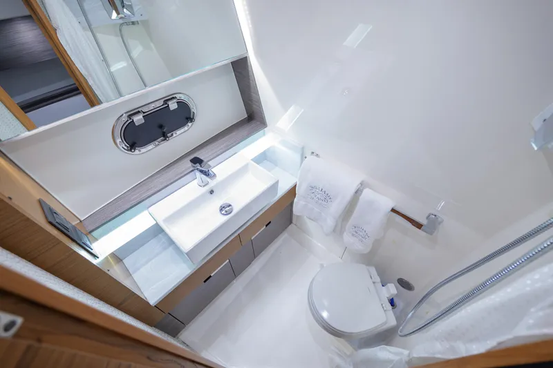 Slide: The Image of Luxurious bathroom in 2020 Tiara Yachts 43 LS, featuring modern sink and toilet. - 61