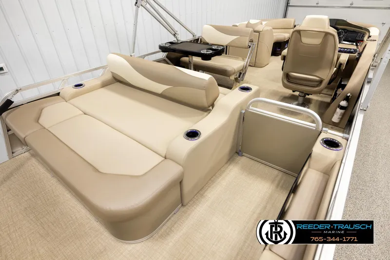 Slide: The Image of Luxurious 2026 Avalon LSZ ENT pontoon boat interior with beige seating and modern amenities. - 12