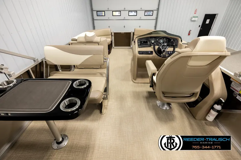 Slide: The Image of Luxurious interior of 2026 Avalon LSZ ENT pontoon boat with plush seating and modern helm. - 17