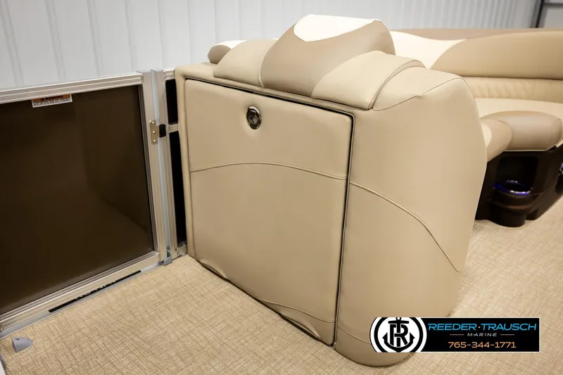 Slide: The Image of 2026 Avalon LSZ ENT boat interior with beige seating and storage compartment. - 20