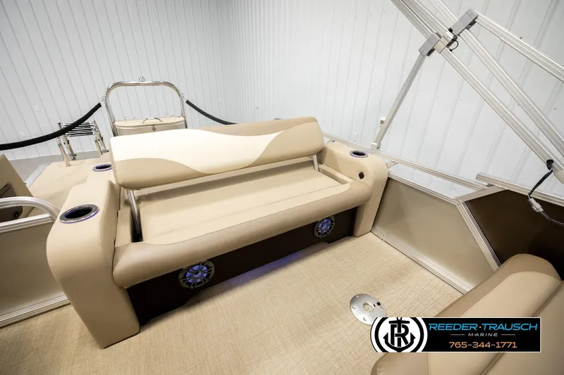 Slide: The Image of 2026 Avalon LSZ ENT boat interior with beige seating and cup holders. - 27