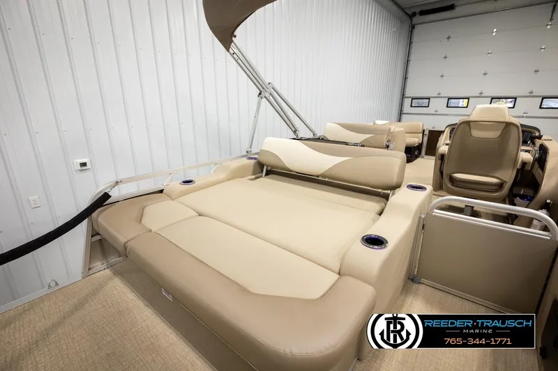 Slide: The Image of 2026 Avalon LSZ ENT pontoon boat interior with beige seating and modern design. - 30