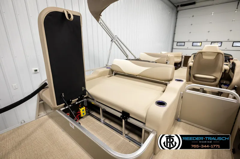 Slide: The Image of 2026 Avalon LSZ ENT pontoon boat interior with beige seating and storage compartment. - 31