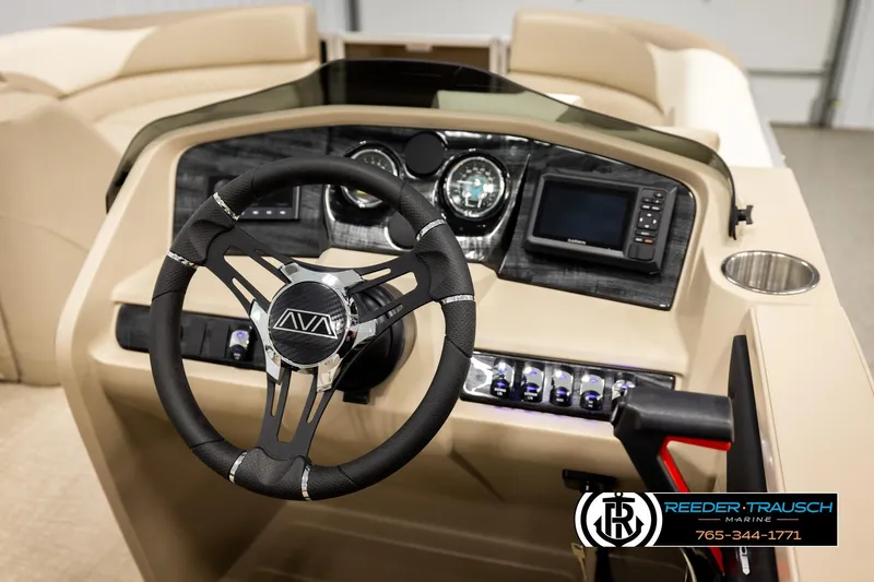 Slide: The Image of 2026 Avalon LSZ ENT boat dashboard with steering wheel and navigation controls. - 34