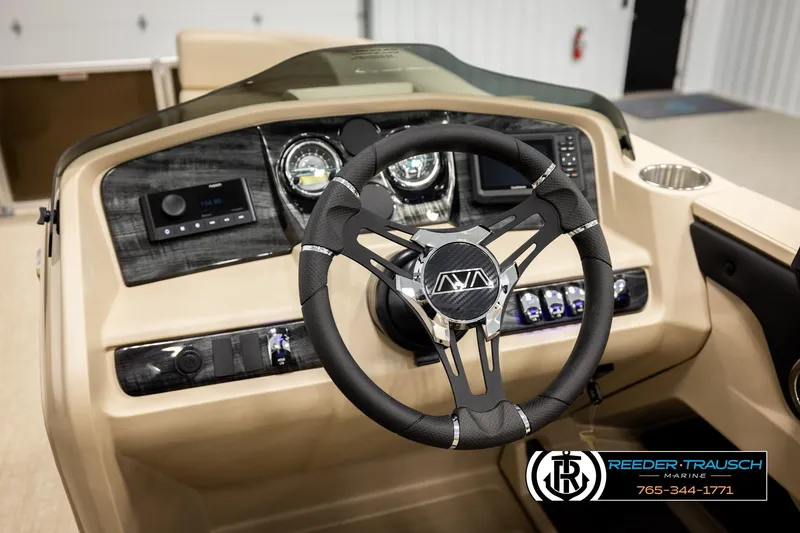 Slide: The Image of Steering wheel and dashboard of 2026 Avalon LSZ ENT boat, featuring modern controls. - 35