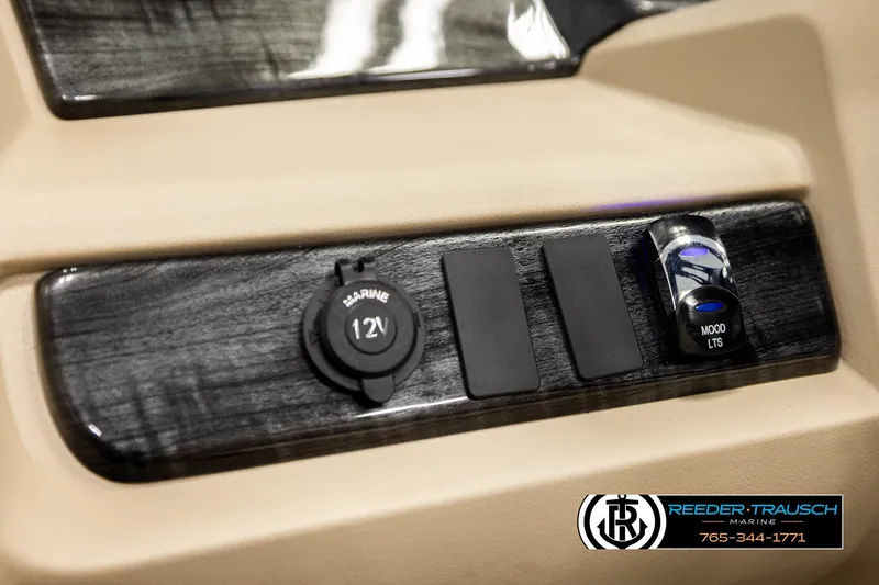 Slide: The Image of Control panel of 2026 Avalon LSZ ENT with 12V outlet and mood lighting switch. - 37