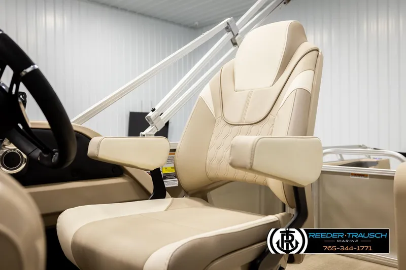 Slide: The Image of Luxurious seating in 2026 Avalon LSZ ENT boat, featuring beige upholstery and armrests. - 44