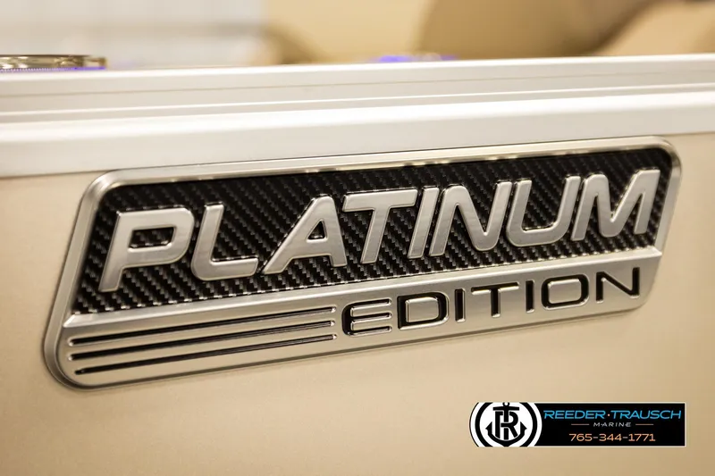 Slide: The Image of 2026 Avalon LSZ ENT Platinum Edition badge with Reeder-Trausch Marine logo. - 55