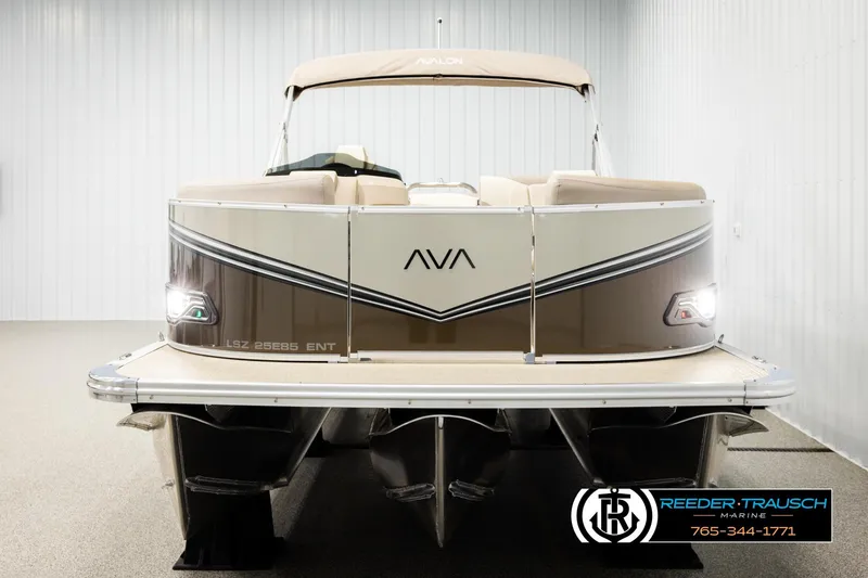 Slide: The Image of 2026 Avalon LSZ ENT pontoon boat in showroom, front view with elegant design. - 8
