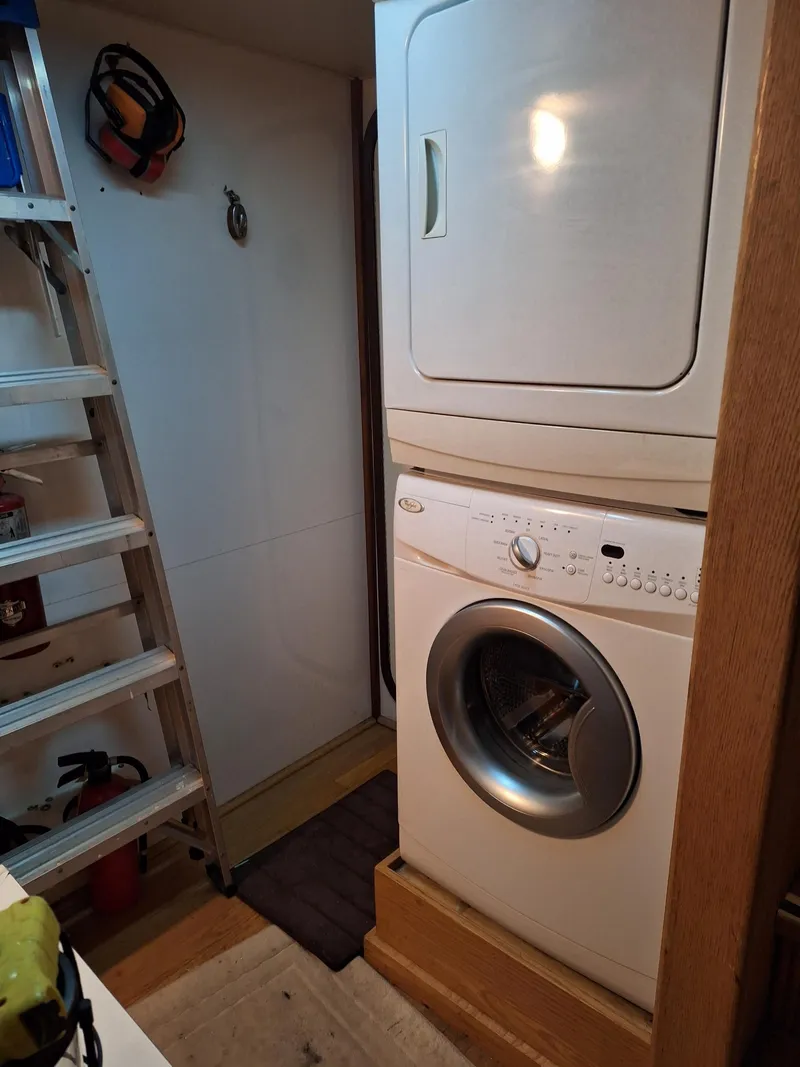 Slide: The Image of Stacked washer and dryer in 1988 Viking Motor Yacht laundry area. - 17