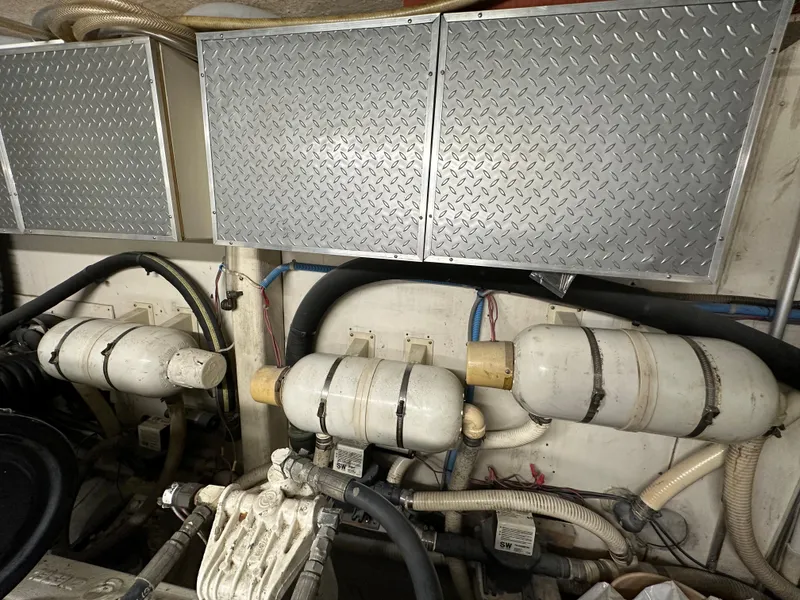 Slide: The Image of Engine room of a 1988 Viking Motor Yacht with mechanical components. - 34