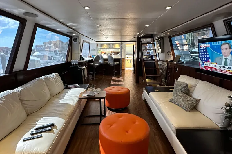 Slide: The Image of Luxurious interior of a 1988 Viking Motor Yacht with modern furnishings and large windows. - 45