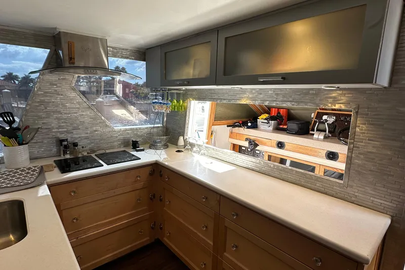 Slide: The Image of Modern kitchen in a 1988 Viking Motor Yacht with sleek cabinetry and appliances. - 46