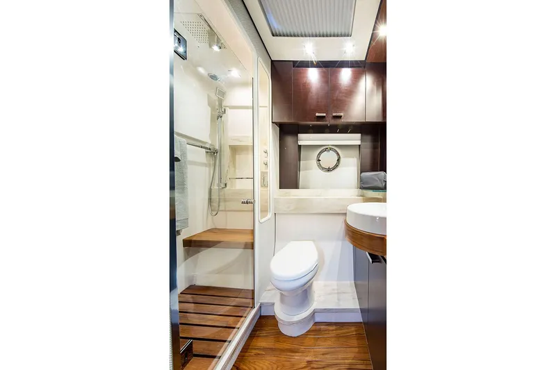 Slide: The Image of Manufacturer Provided Image: Luxurious 2020 Tiara Yachts C53 Coupe interior cabin with twin beds and modern decor. - 10