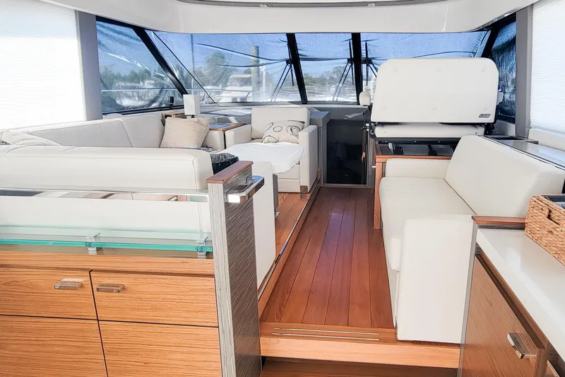 Slide: The Image of Luxurious interior of 2020 Tiara Yachts C53 Coupe with elegant seating and wood flooring. - 17