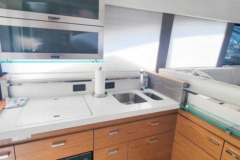 Slide: The Image of Modern kitchen interior of 2020 Tiara Yachts C53 Coupe with sleek cabinetry and dual sinks. - 18