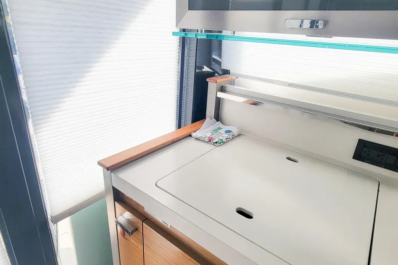 Slide: The Image of Interior of 2020 Tiara Yachts C53 Coupe, featuring sleek cabinetry and modern design elements. - 21