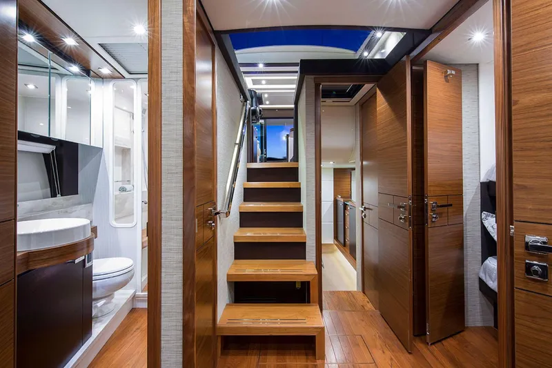 Slide: The Image of 2020 Tiara Yachts C53 Coupe, docked with swim platform, sleek white design. - 7