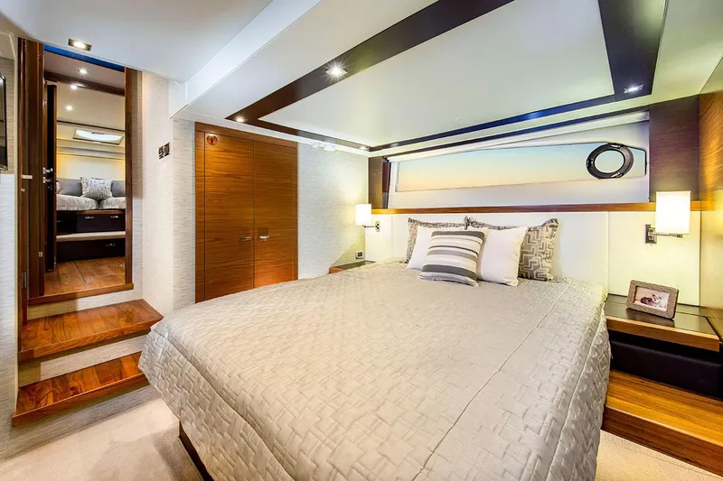 Slide: The Image of Manufacturer Provided Image: Interior of 2020 Tiara Yachts C53 Coupe with wooden stairs and modern design. - 8