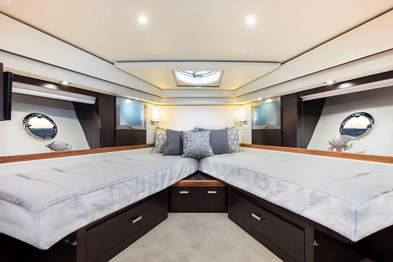 Slide: The Image of Manufacturer Provided Image: Luxurious bedroom interior of 2020 Tiara Yachts C53 Coupe with modern design and cozy lighting. - 9
