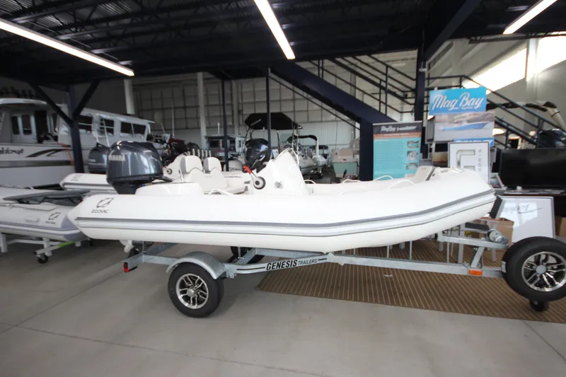 The Image of 2026 Zodiac Yachtline 400 inflatable boat on trailer in showroom. - 0