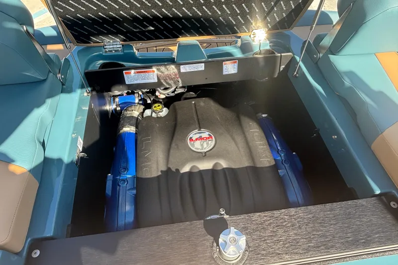 Slide: The Image of 2026 MasterCraft XT22 engine compartment with Ilmor engine, open hatch view. - 12