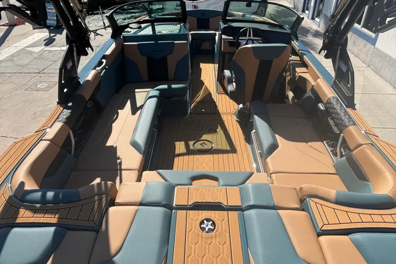 Slide: The Image of 2026 MasterCraft XT22 boat interior with luxurious seating and modern design. - 7