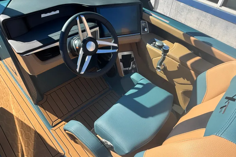 Slide: The Image of 2026 MasterCraft XT22 boat interior with modern steering and controls. - 8